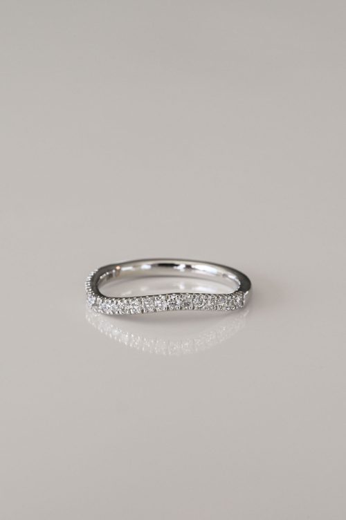 Contoured pavé diamond wedding band in 14k ultra white gold, designed to pair with a complementary engagement ring.