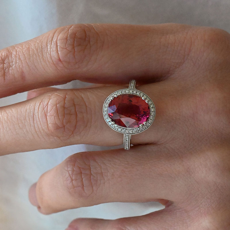 GemstoneRings-4 Oval-cut pink tourmaline ring set in white gold with a pavé diamond halo and matching pavé-set split shank.